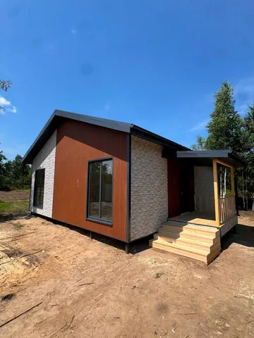 Каркасный дом 99 м² с навесом над крыльцом